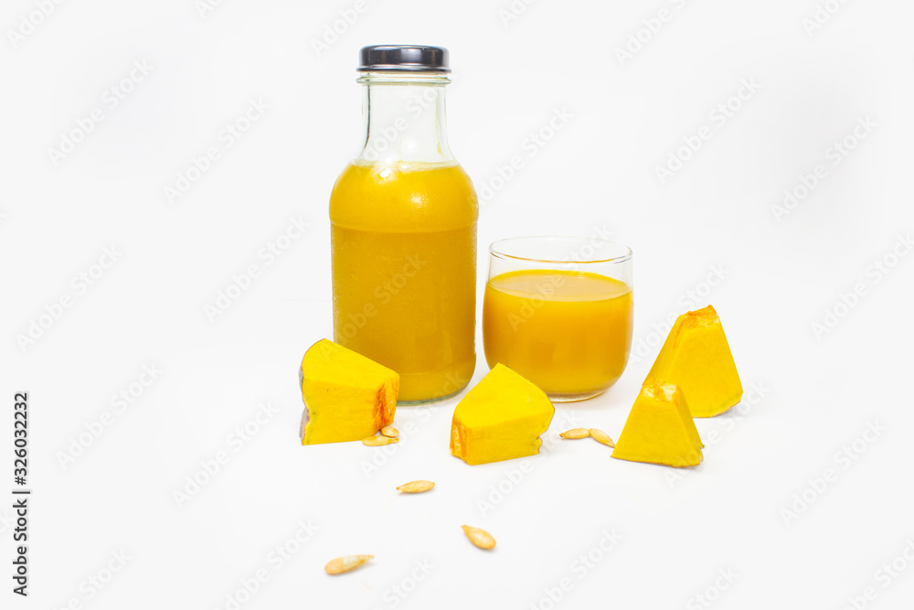 Fresh pumpkin juice in glasses and bottles , Healthy fruit. On white background Fresh pumpkin juice in glasses and bottles , Healthy fruit. On white background