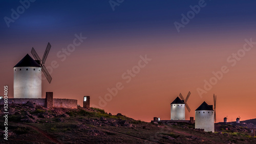 sunset view of the typical windmills of the Don Quixote route,.Herencia, Castile-La Mancha, Spain