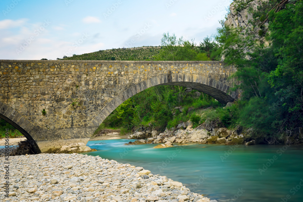 An old bridge over the river in French Provence.