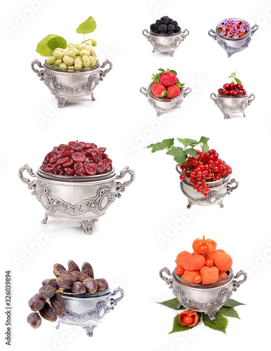 Assorted fresh ripe fruits in a metal container on isolated white background . Food concept background.