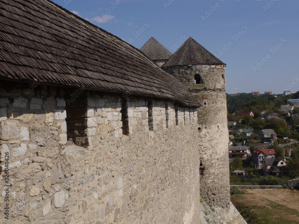 Medieval castle in the city of Kamyanets-Podilsky, Ukraine . It is a formidable, strong fortress, whose walls are cut out of solid rock. The fortress stands at the top of a precipitous cliff . Medieval castle in the city of Kamyanets-Podilsky, Ukraine . It is a formidable, strong fortress, whose walls are cut out of solid rock. The fortress stands at the top of a precipitous cliff .