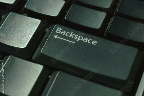 backspace tab on black computer keyboard background and texture photo