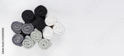 Rolled up bath towels isolated on white background with copy space. Top view. 