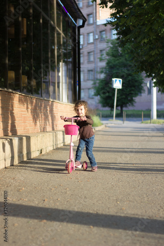 Yong kid girl ride on stree...
