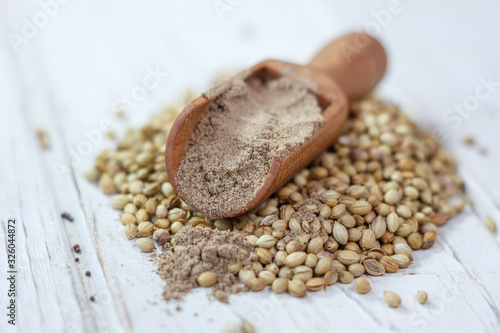Coriander seeds on a white ...