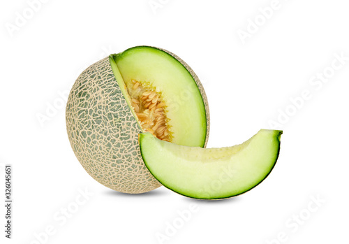 whole and sliced green melon on white background