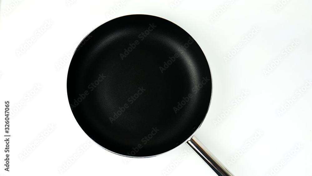 Black pan on white background, Concept Kitchen in the restaurant, Top view Blank for design.. Black pan on white background, Concept Kitchen in the restaurant, Top view Blank for design..