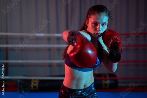 Female kickboxer training © Xalanx