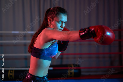 Female kickboxer training