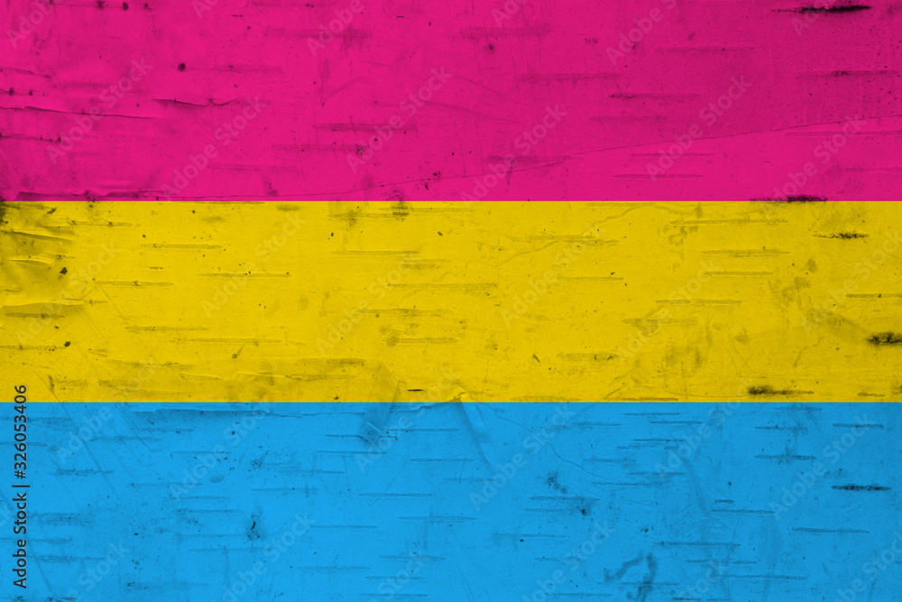A rustic old pansexual flag on weathered wood A rustic old pansexual flag on weathered wood