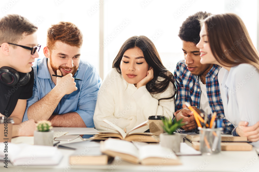 Learning concept. Multinational students preparing to exam Learning concept. Multinational students preparing to exam