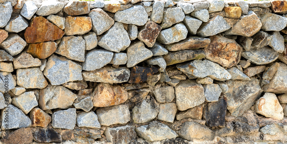 Natural stone masonry wall texture or background Natural stone masonry wall texture or background
