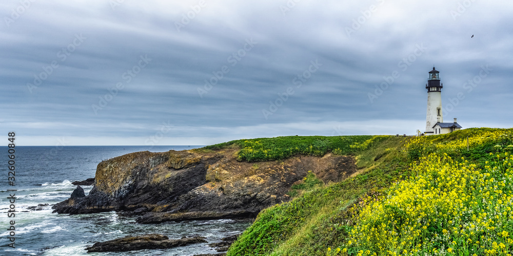 Panoramic landscape Yaquina Head Outstanding Natural Area with its lighthouse and rocky basaltic headlands, Oregon Coast, Newport, USA.