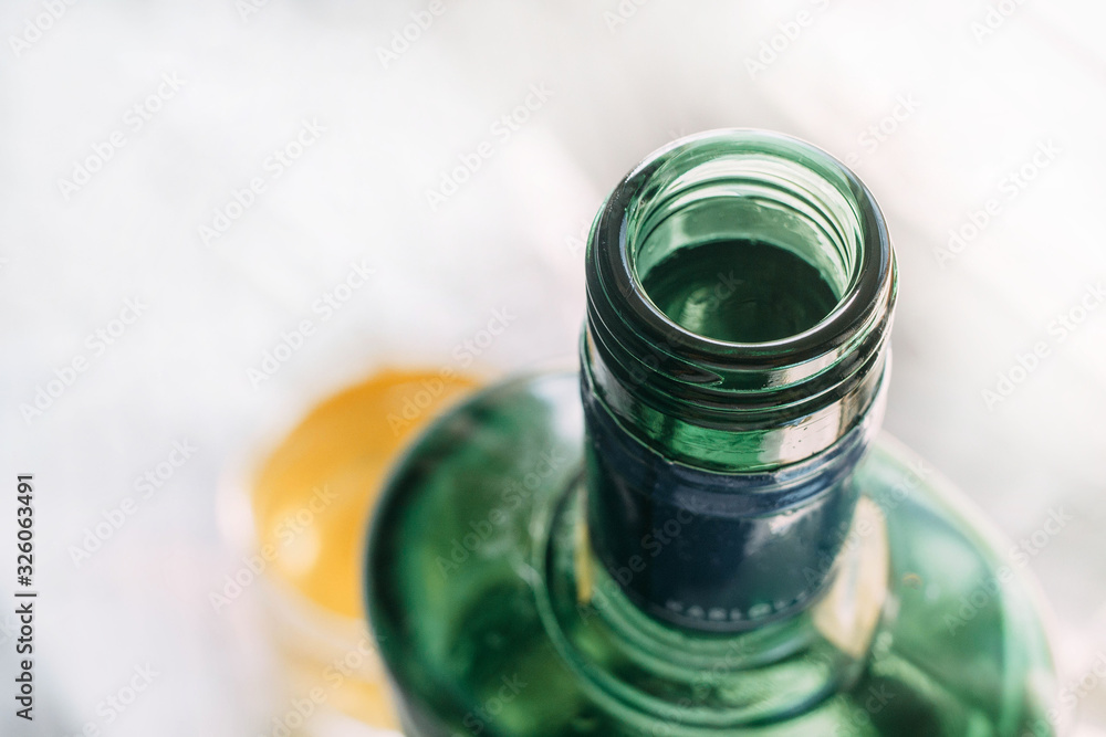 green bottle of beherovka on a white background