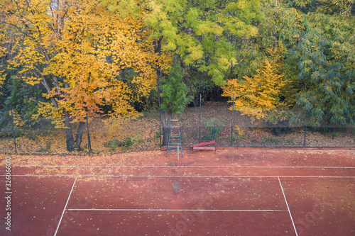 Tennis court in autumn with trees in Prague, Czech Republic
