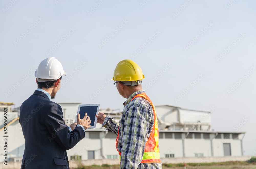 construction engineer standing in a conversation on the construction site construction engineer standing in a conversation on the construction site