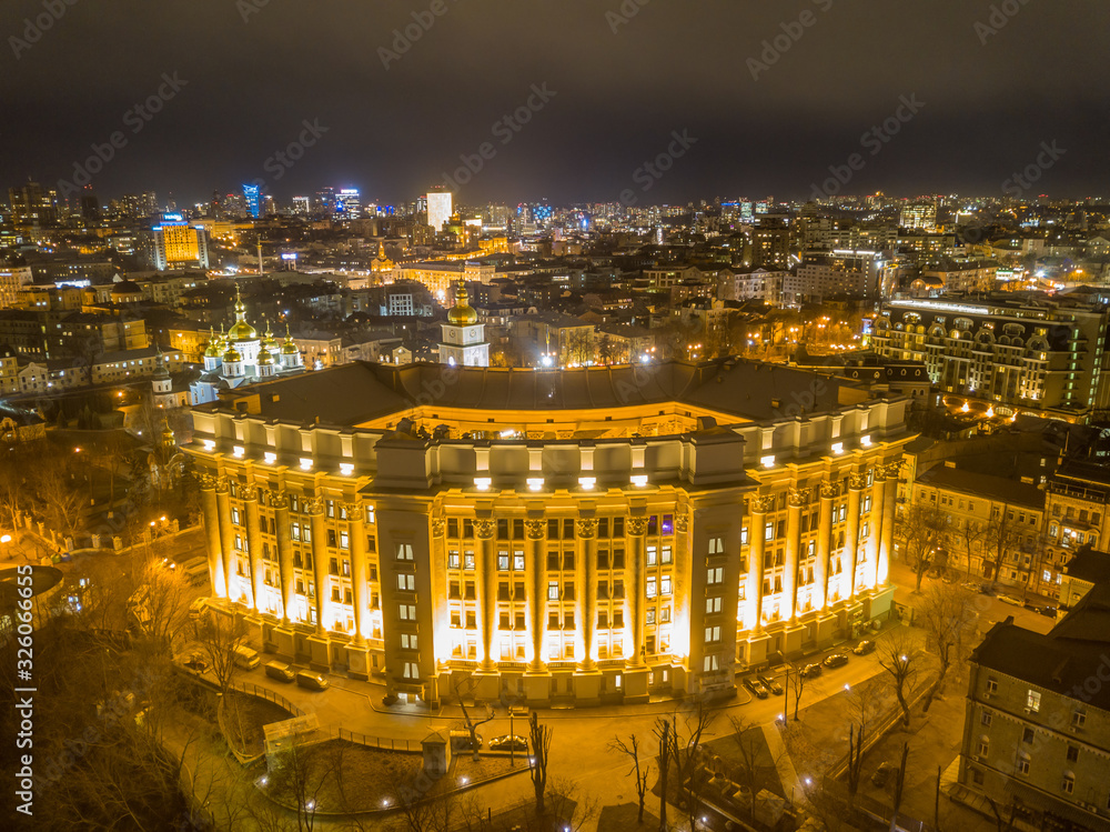Aerial night drone view. Ministry of Foreign Affairs in Kiev with evening illumination