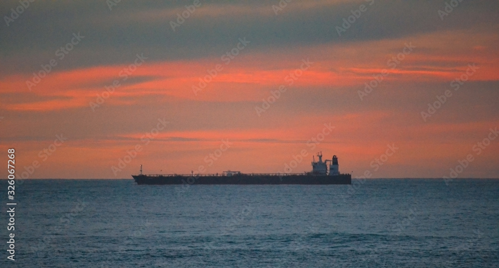 big ship on the sea during sunset in Australia