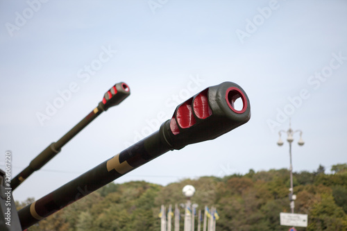Gun howitzer close-up. The gun barrel is close. Military equipment.