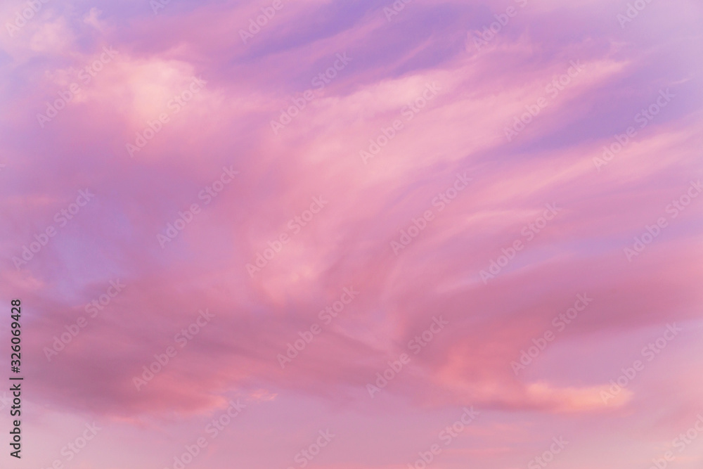Dramatic soft sunrise, sunset pink violet sky with clouds background texture