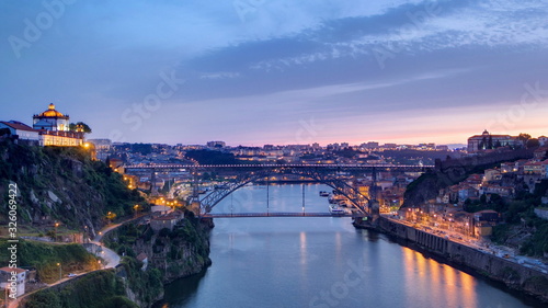 Day to Night view of the historic city of Porto, Portugal timelapse with the Dom Luiz bridge