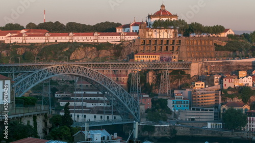 Sunset time, shadow cover Douro riverside with the Dom Luiz bridge timelapse, Porto , Portugal. Travel background