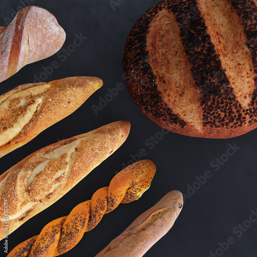 Different types of bread and rolls in the top view. Kitchen or bakery poster design on dark.