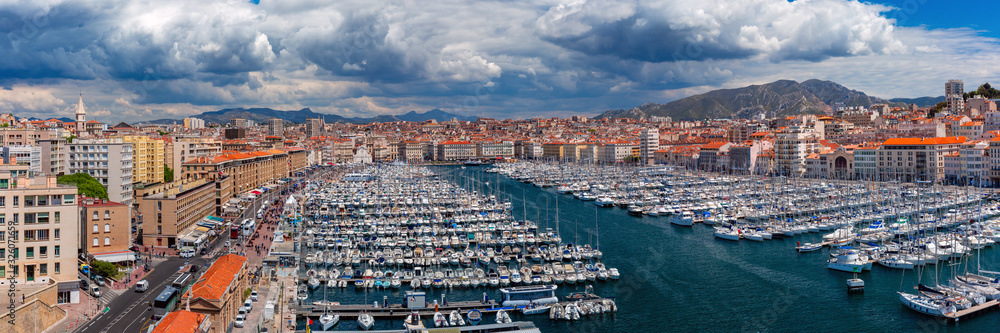Panoramic view of sunny Old Vieux Port on sunny day in the historical city center of Marseilles on sunny day, France