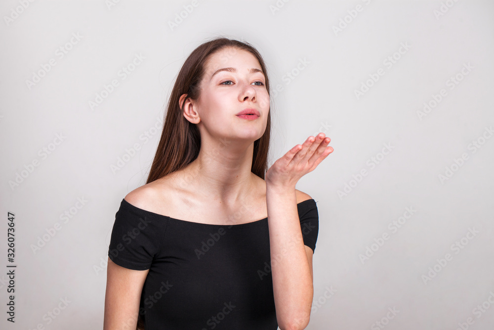 Close up portrait of a young beautiful girl isolated on gray background Close up portrait of a young beautiful girl isolated on gray background