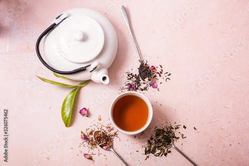 Tea concept, different kindes of tea, teapot, cup of tea photo