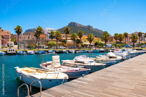 Fototapeta Naklejka Na Ścianę i Meble -  Golfo Aranci, Sardinia, Italy - Panoramic view of Golfo Aranci yacht port - Marina di Golfo Aranci - with seashore park boulevard at the Tyrrhenian Sea coast