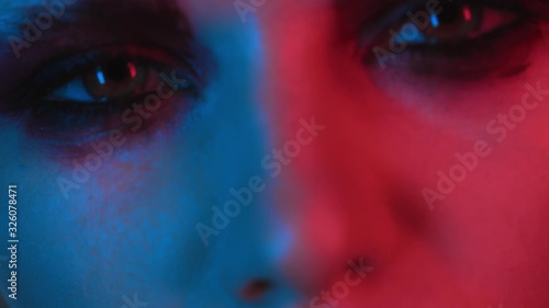 female eyes nose and lips of young beautiful girl with trendy bold fashion makeup, woman face drunk and tired face in club or at party in bar