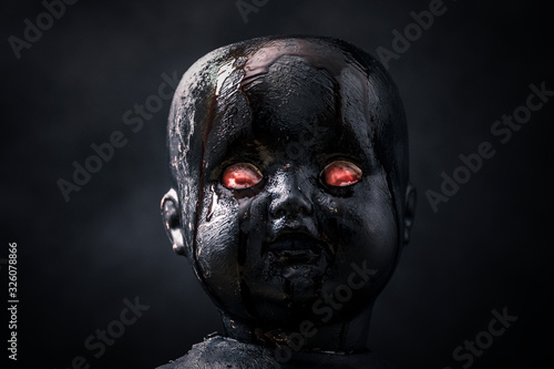 Fotografia Creepy bloody doll in the dark