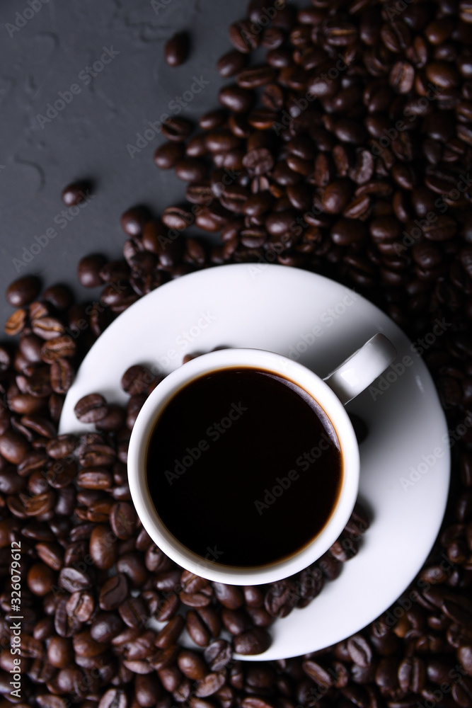 Fototapeta premium Coffee cup and beans on old grey kitchen beton , rock table. with copyspace for your text