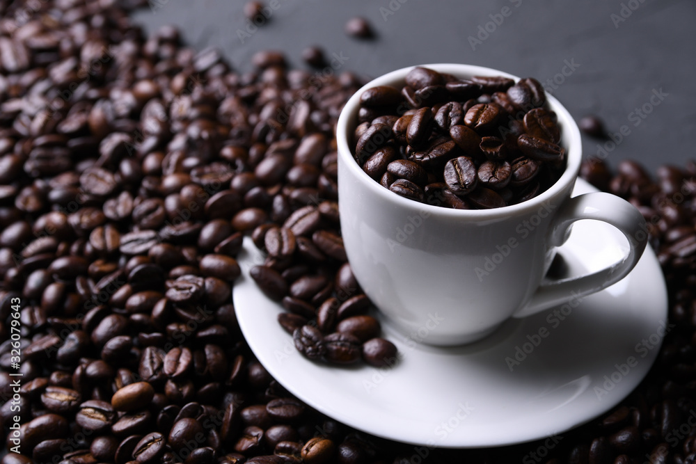 Fototapeta premium Coffee cup and beans on old grey kitchen beton , rock table. with copyspace for your text
