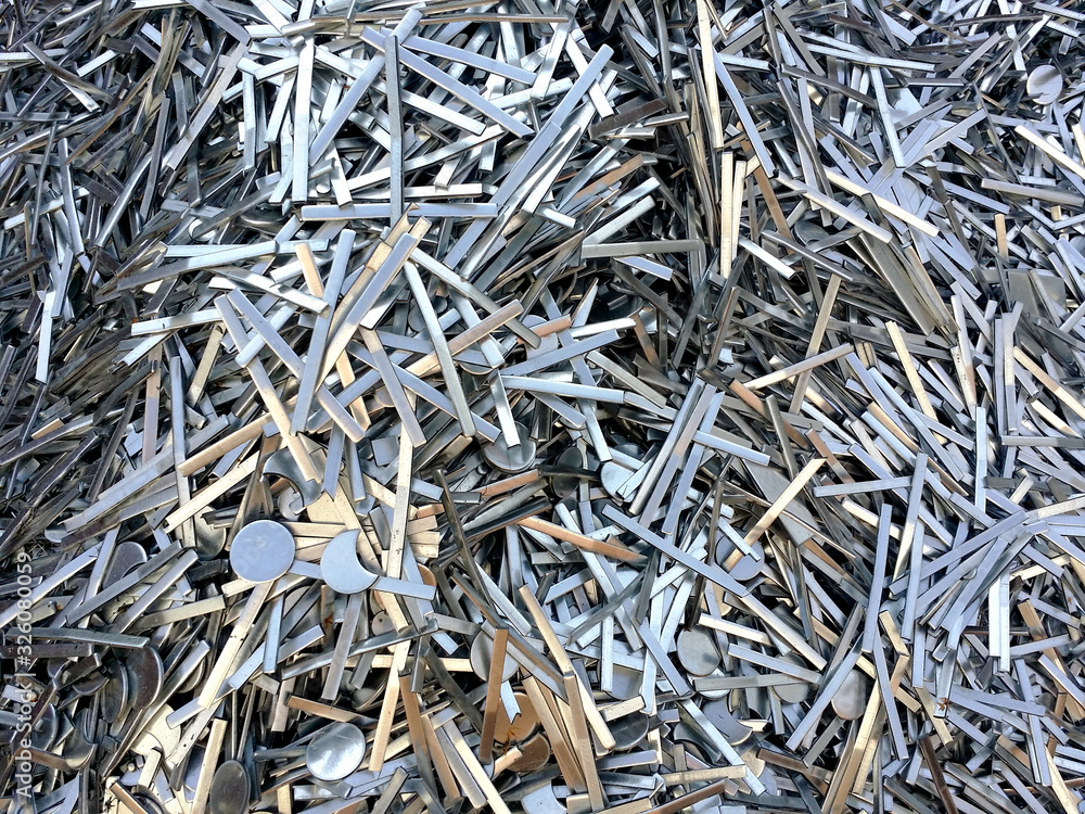 Steel scrap materials recycling. Abstract, background and texture of metal waste. Waste after machining metal parts on a cnc lathe Steel scrap materials recycling. Abstract, background and texture of metal waste. Waste after machining metal parts on a cnc lathe