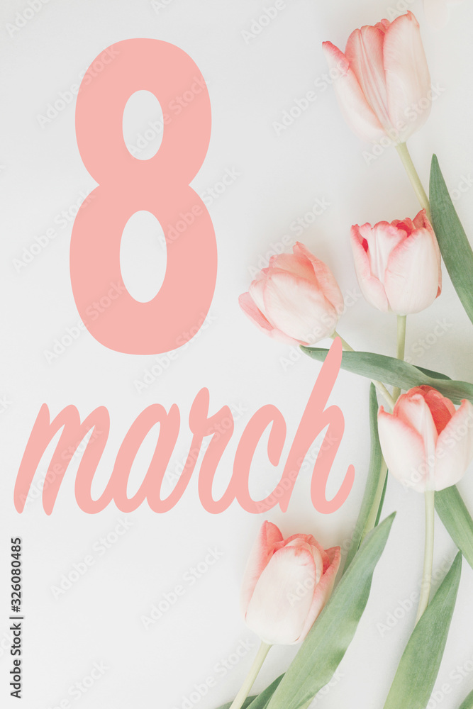 8 march. Happy womens day floral greeting card. 8 march text on pink tulips stylish border flat lay on white background. Handwritten lettering. International women day. Vertical image 8 march. Happy womens day floral greeting card. 8 march text on pink tulips stylish border flat lay on white background. Handwritten lettering. International women day. Vertical image