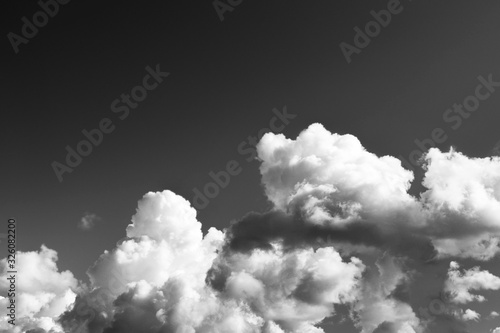 Black sky background with white clouds Abstract background