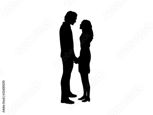 Silhouettes of lovers man and woman holding hands