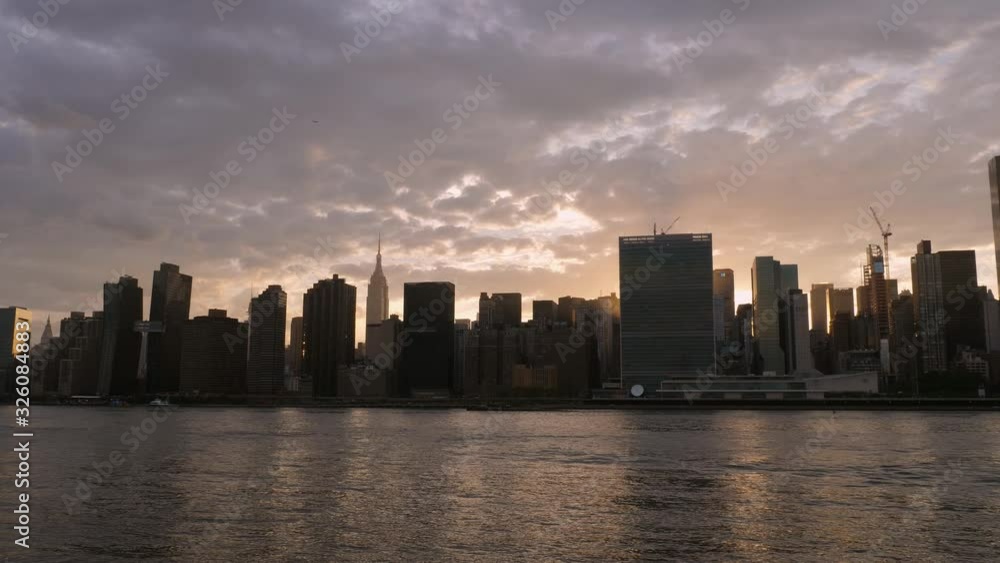 Manhattan sunset with Empire State Building illuminated by sun. NYC. Manhattan sunset with Empire State Building illuminated by sun. NYC.