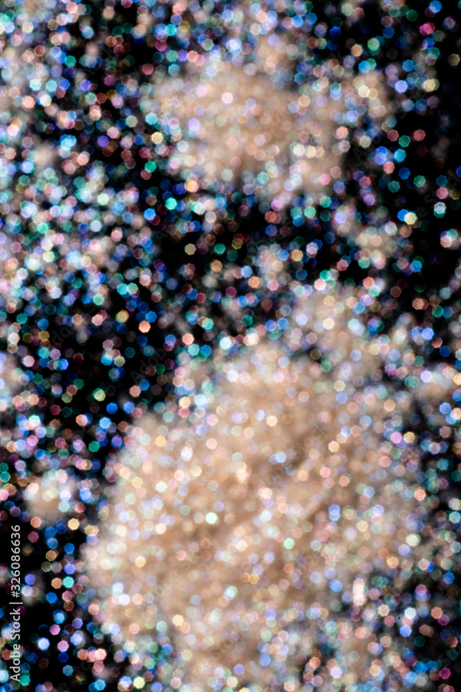 bokeh multicolored glitter lights background colorful lens effect, copy space.