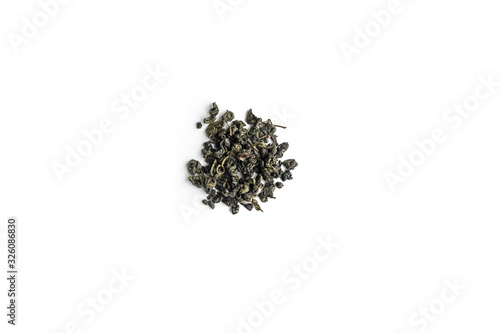 different sorts of black or green tea in bulk on a white background close-up isolated