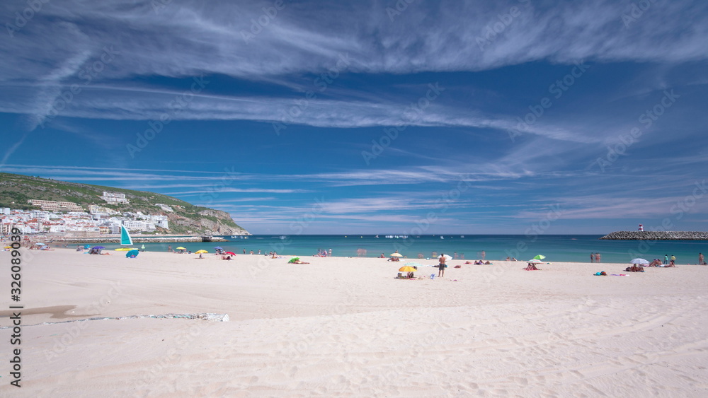 Beach in Sesimbra with moving clouds, Portugal timelapse