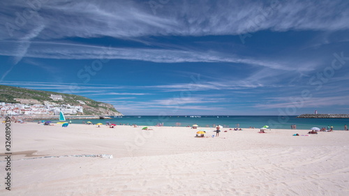 Beach in Sesimbra with moving clouds, Portugal timelapse © neiezhmakov