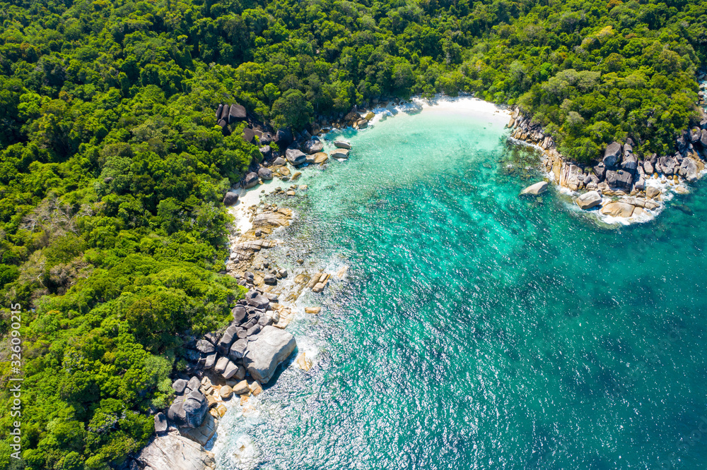 Aerial view of ocean waves, Beautiful tropical beach and rocky coastline and beautiful forest. Nga Khin Nyo Gyee Island Myanmar