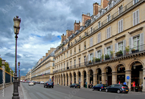 Street view in Hausmann architecture quarters in Paris center, France