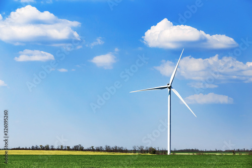 Wind turbine of blue sky with clouds background photo