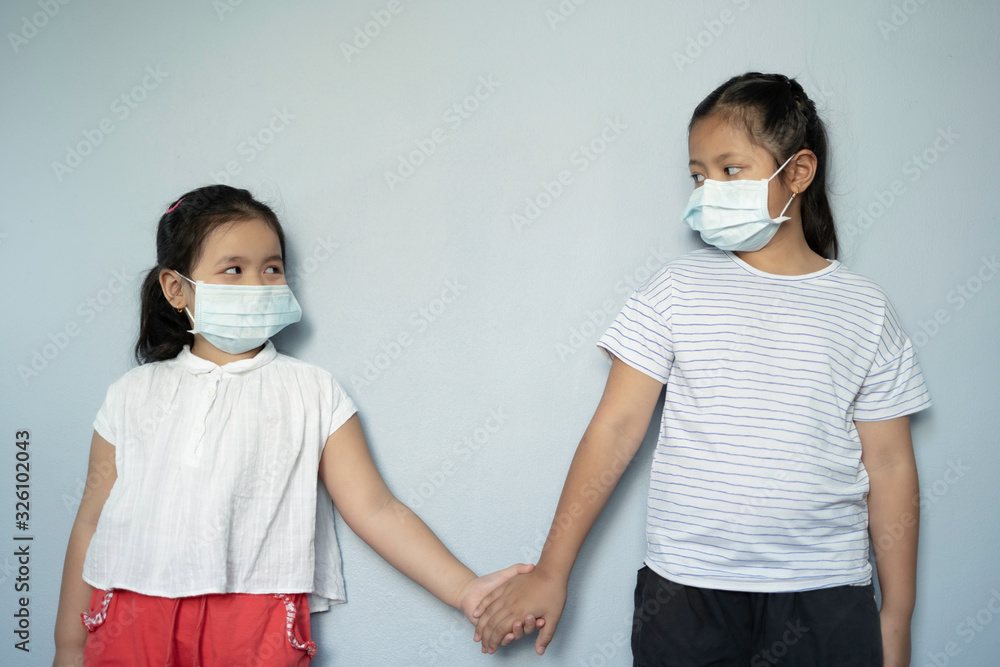 Children girl waring mask to protect Covid-19 virus and PM2.5 air pollution