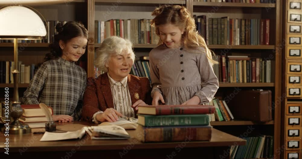 Caucasian Old Happy Good Looking Grandmother Sitting At Table In ...