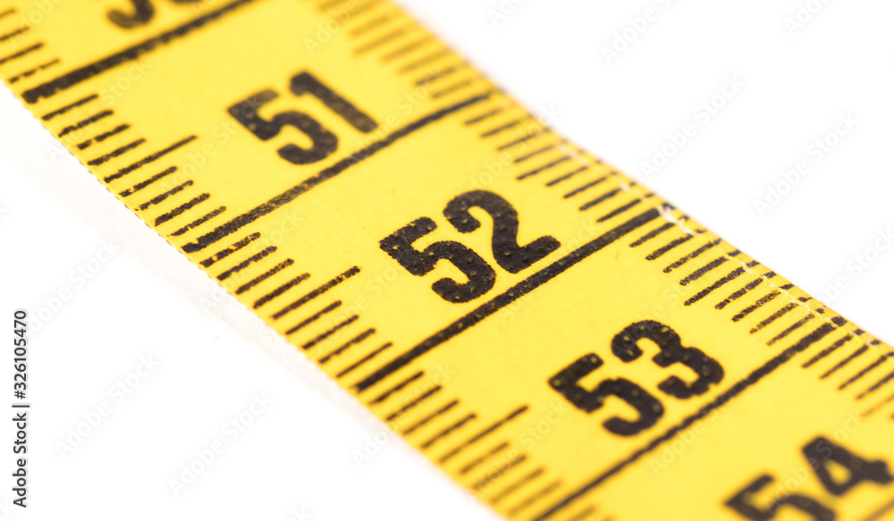 Close-up of a yellow measuring tape isolated on white - 52 Close-up of a yellow measuring tape isolated on white - 52